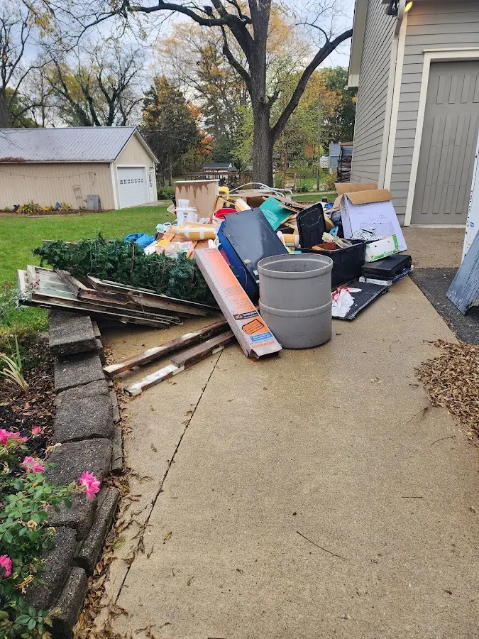 Dumpster being loaded with debris for Demolition Dumpster Rental in St. Louis